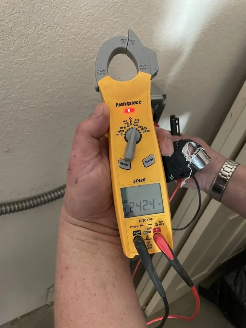 Voltage testing with clamp meter during Outlet Installation in Lockhart